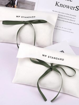 white pouch with bow tie