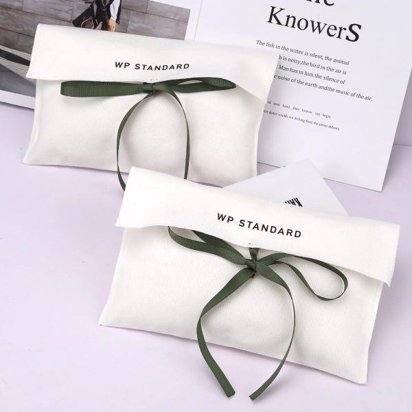 white pouch with bow tie